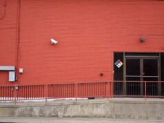 Business Crime in Britain: Close to a Third of Firms Face Being Targeted This Year Security camera and rear entrance on a commercial building: Business Crime in Britain: Close to a Third of Firms Face Being Targeted This Year