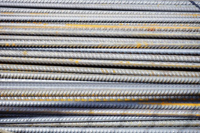 Close-up of stacked steel reinforcing bars ready for use on a construction site