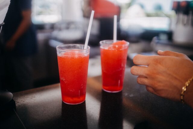 Slush Machine Safety: The Plug, the Bowl and Everything in Between Two red slushy drinks with straws on a bar counter